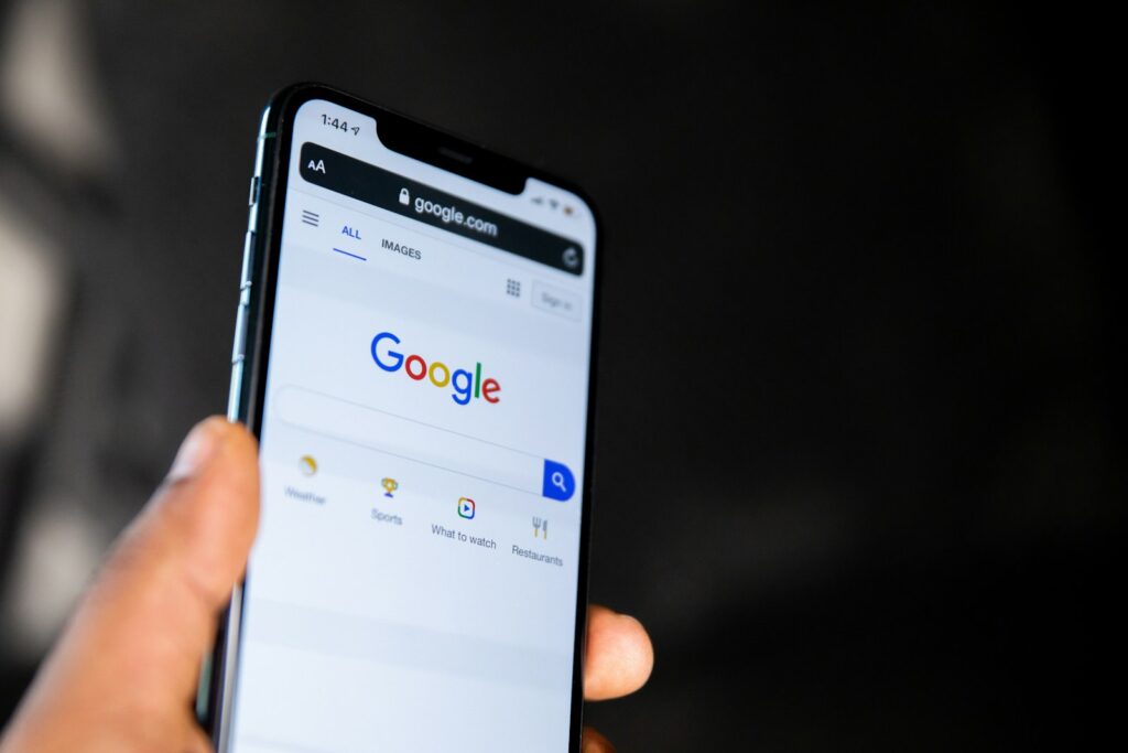 Customer in Dubai searching Google on a smartphone for a local business
